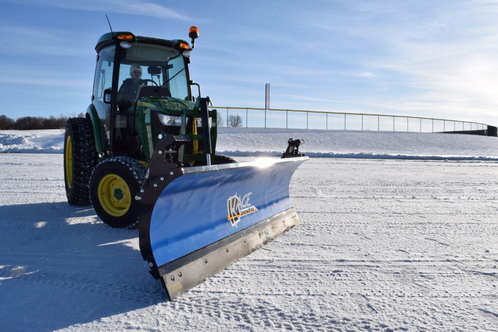 blue tractor snow plow blade