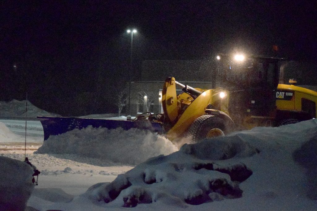SnowDozer Wheel Loader Attachment plowing snow