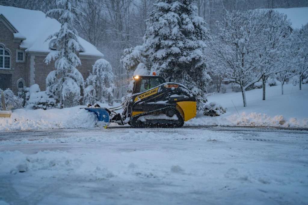 SnowFire Plowing Snow on New Holland CTL