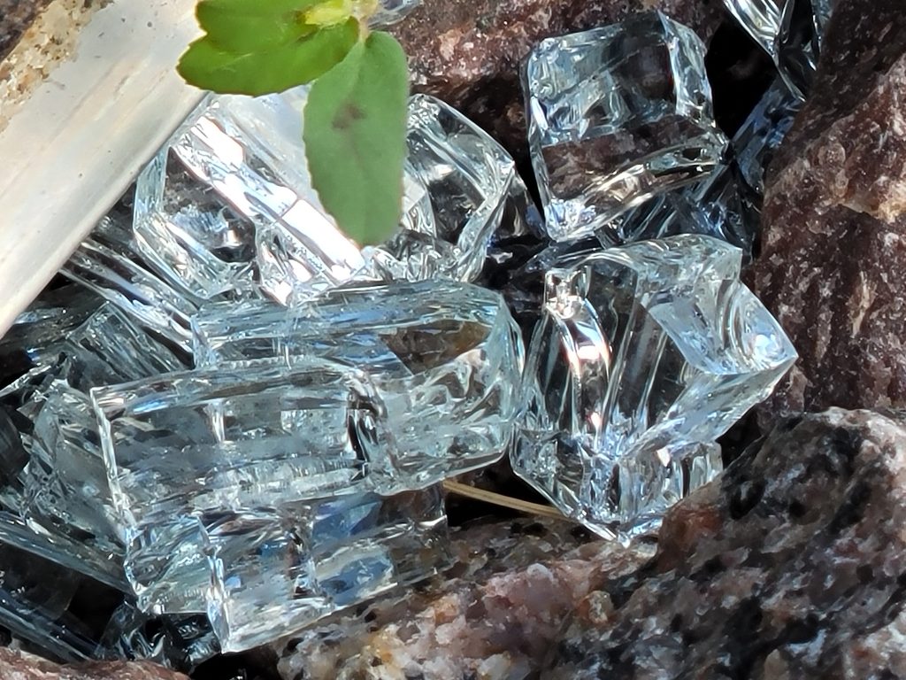 Broken Picture Window Glass in Rock Bed