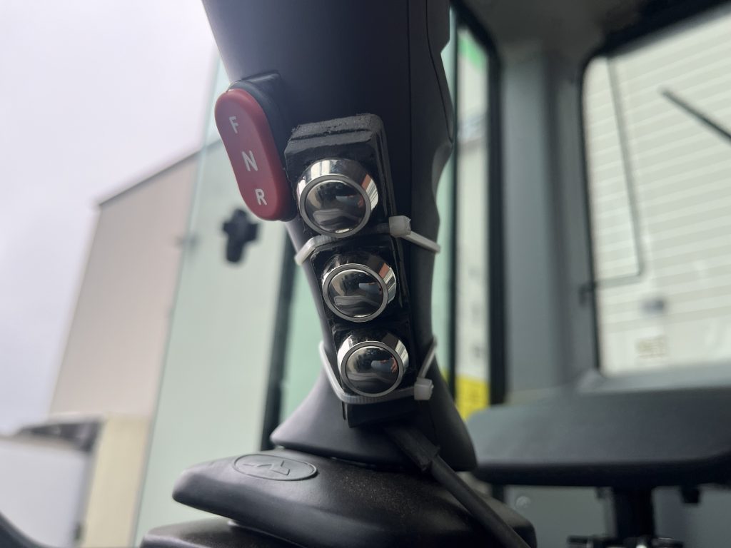 KAGE inline 3 button wing control mounted to Bobcat L255 joystick